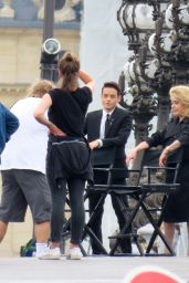 Catherine Deneuve - Filming an YSL Advert on Alexandre III Bridge in Paris 06/24/2022