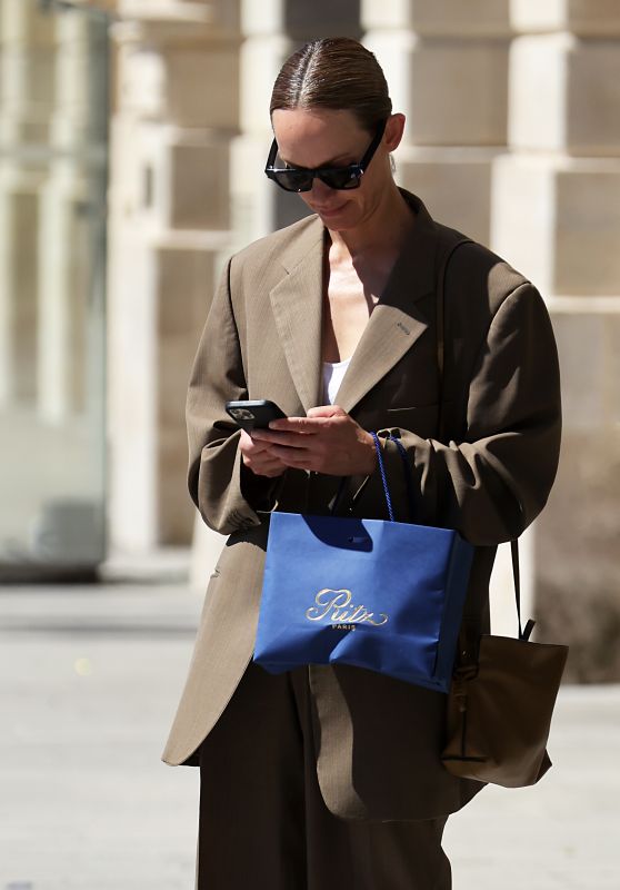 Amber Valletta Wearing Loewe Bag and Off-White Sneakers - Leaving Hotel Ritz in Paris 07/04/2022