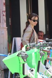 Lily Collins and Charlie McDowell Using an Electric Sharing Scooter in Paris 07/02/2022
