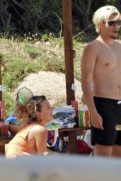 Millie Bobby Brown at a Beach in Sardinia 07/10/2022