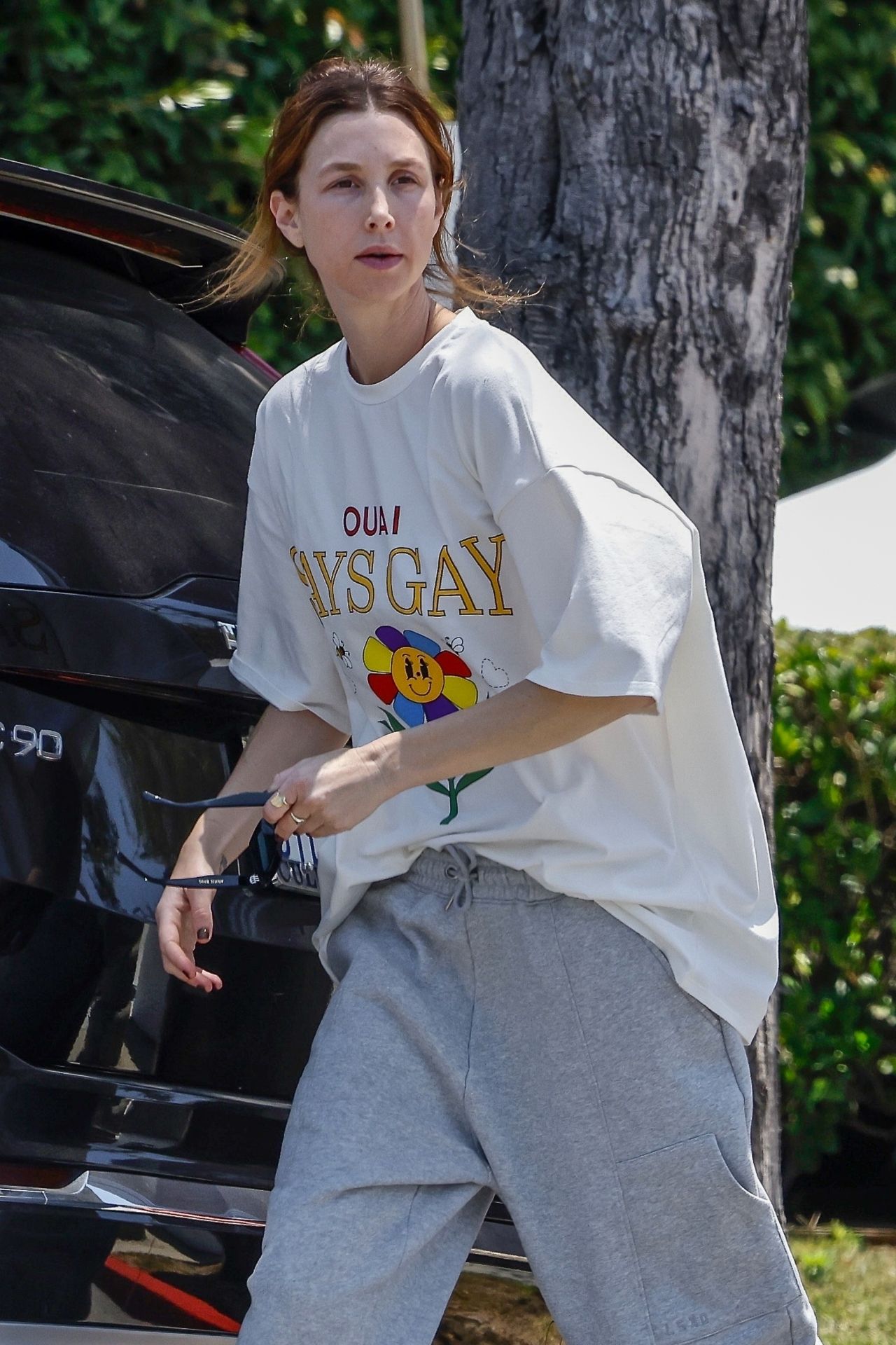 Whitney Port Wearing an OUAI SAYS GAY Tee and Gray Sweat Pants and ...