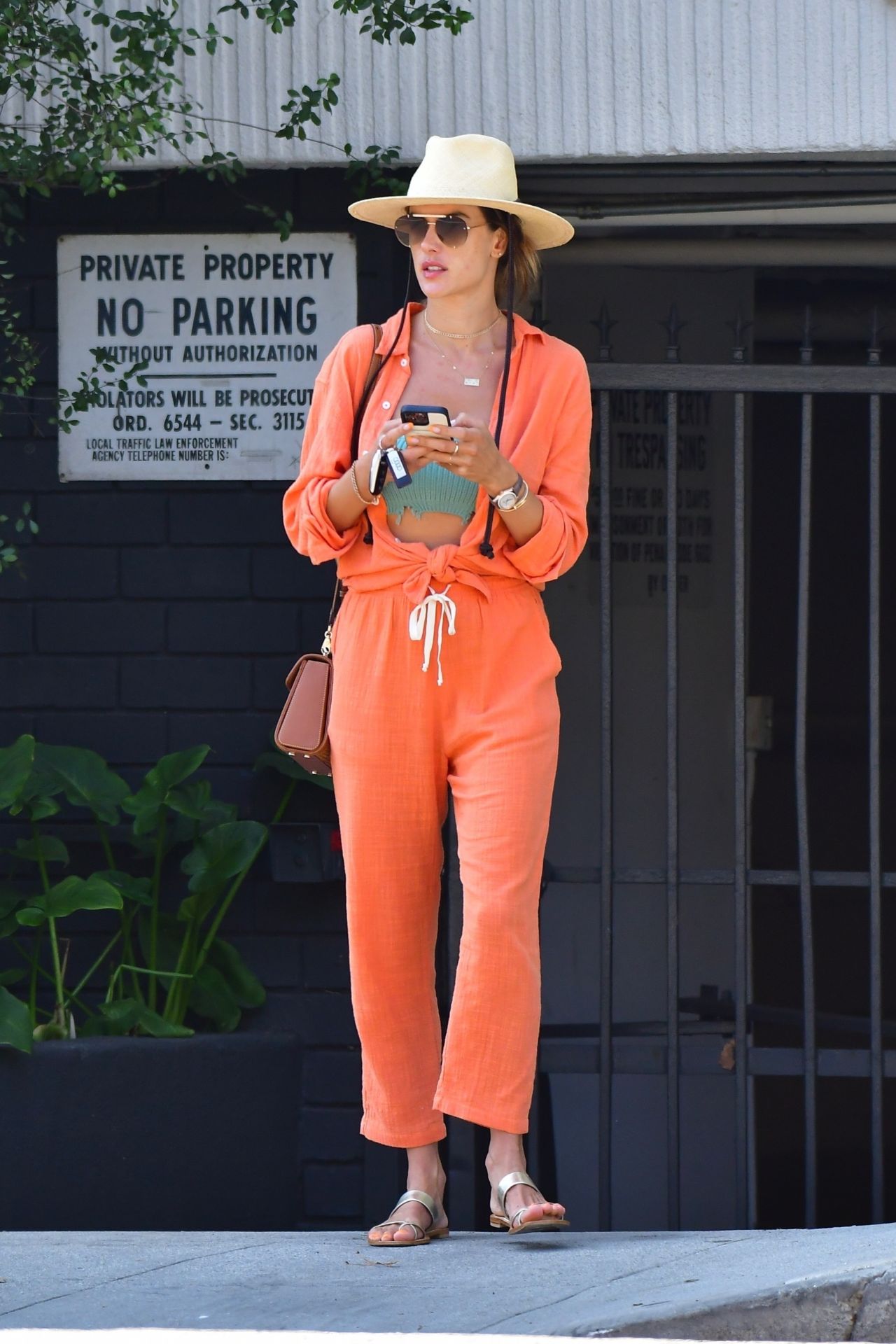 Alessandra Ambrosio Pops in Orange Blazer and Bottega Veneta Mules