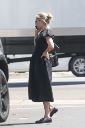 Emma Roberts Wears a Stylish Black Dress and Matching Leather Loafers - Los Angeles 08/17/2022