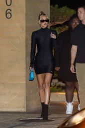 Khloe Kardashian Wearing a Short Form-Fitting Black Dress and Heels 08/08/2022
