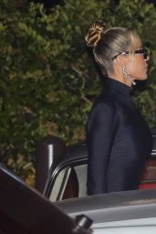 Khloe Kardashian Wearing a Short Form-Fitting Black Dress and Heels 08/08/2022