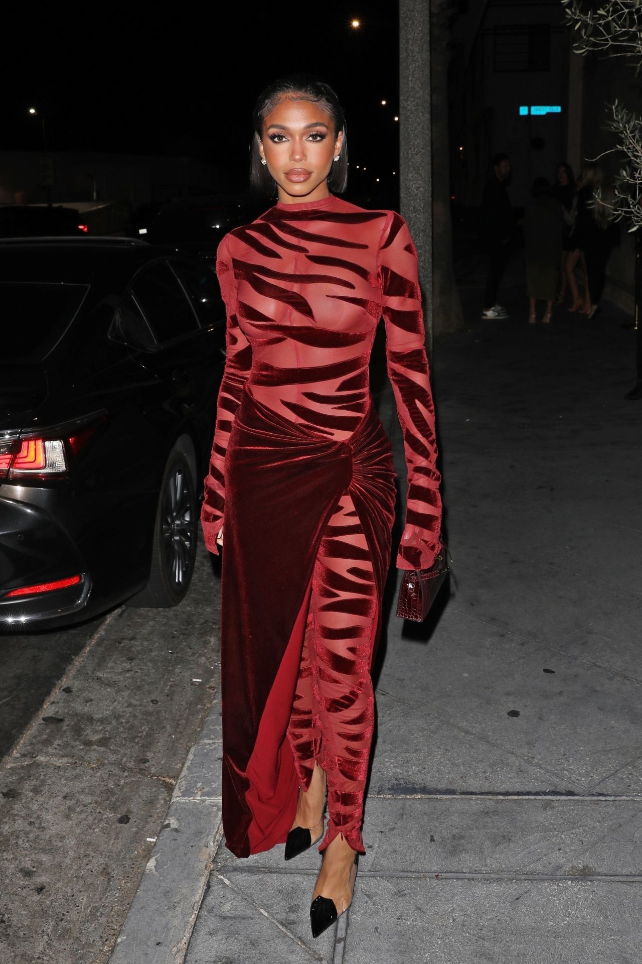 Lori Harvey Night Out Style - Wears a Red Velvet Dress at The Fleur Room in...