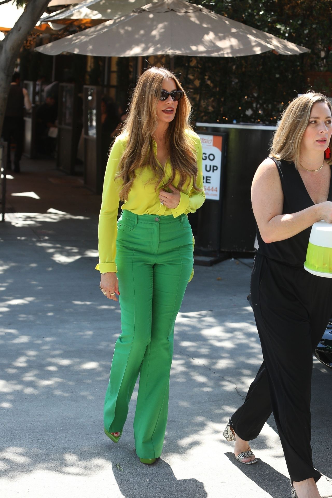 sofia vergara in green blouse and green pants combination 08 19 2022 8
