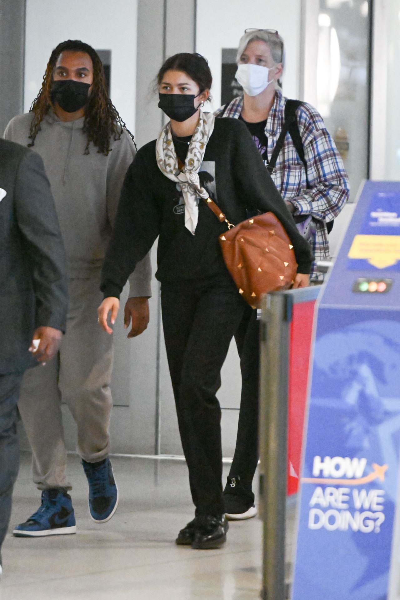 Zendaya arrives in a red hoodie at JFK Airport in New York City