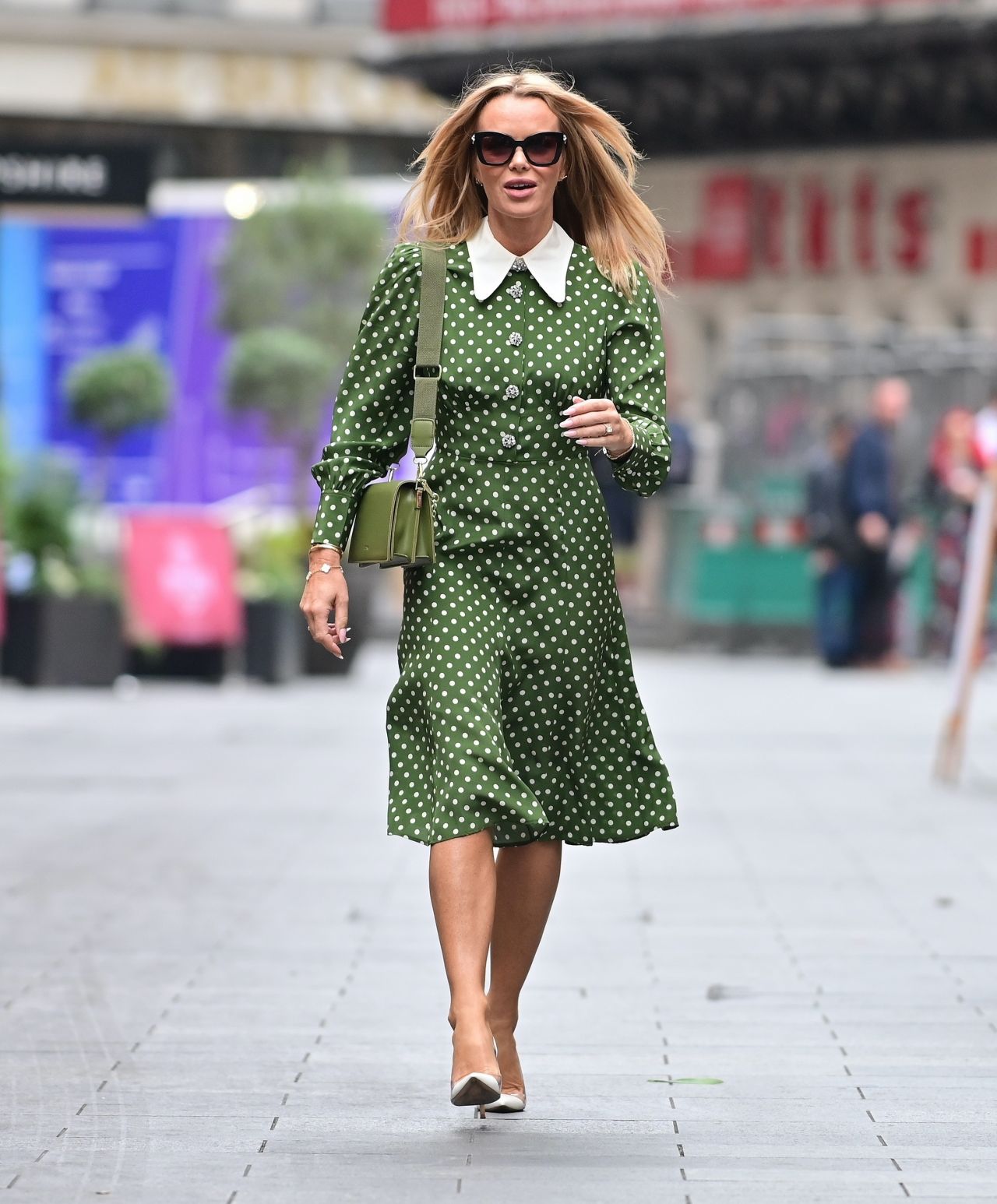 Amanda Holden puts on a chic display in green and white polka dot