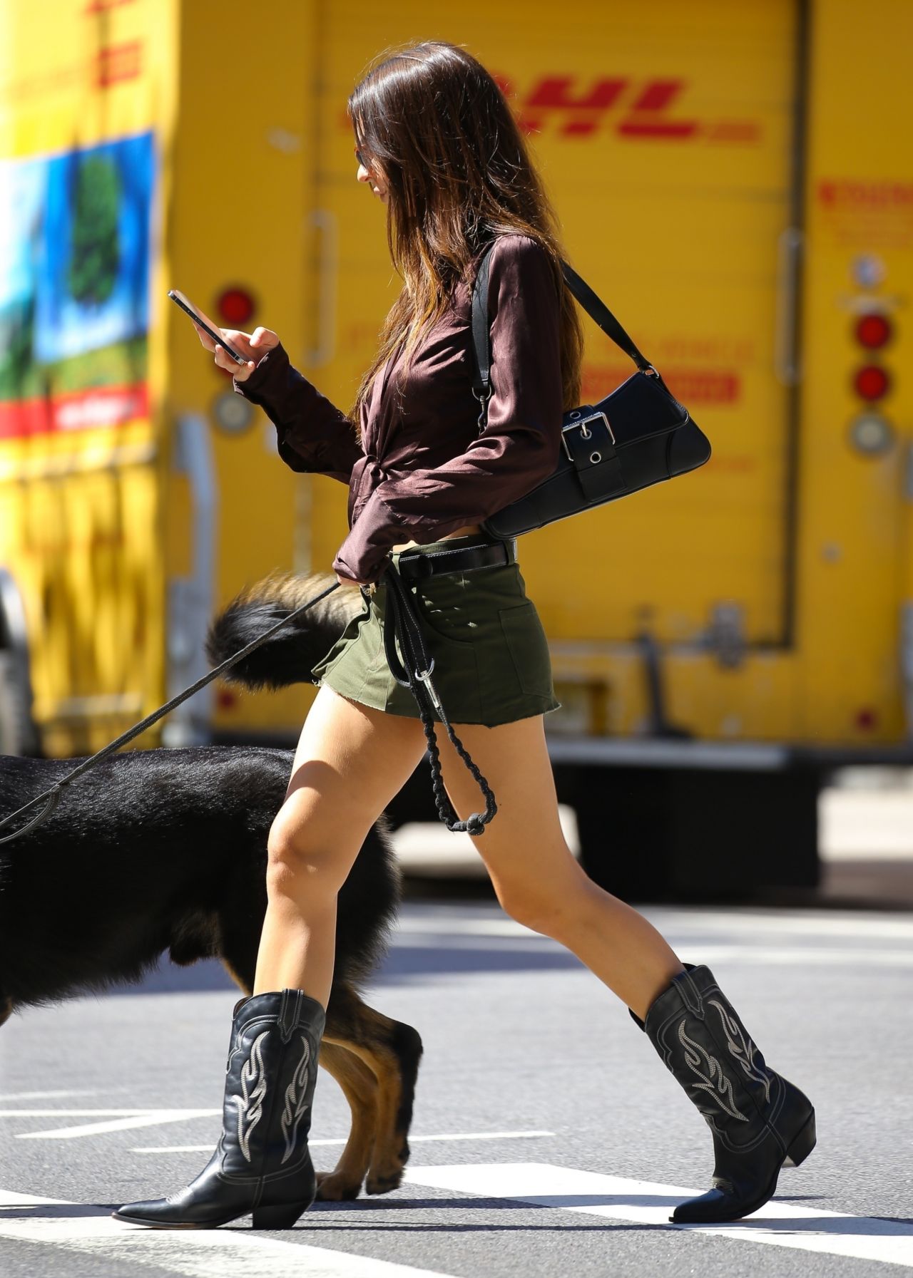 Emily Ratajkowski in a Green Mini Skirt, Brown Shirt and Cowgirl Boots - Ne...