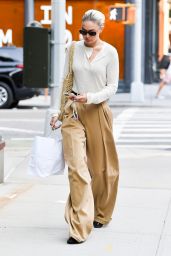Gigi Hadid Wears Beige Slacks and a Cream Top - NY 09/09/2022 • CelebMafia