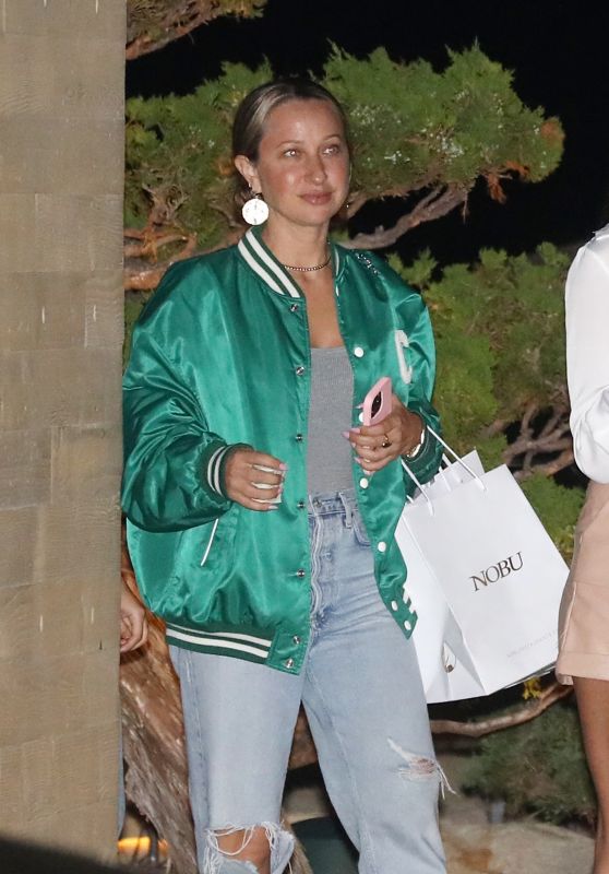 Jennifer Meyer in a Green Varsity Jacket and Distressed Denim at Nobu in Malibu 09/20/2022