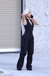 Kim Kardashian in a Plunging Bodysuit and Black Military Pants   Los Angeles 08 31 2022   - 12