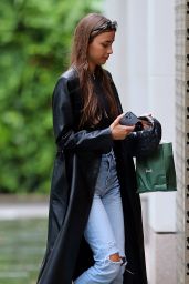 Maria Beregova in a Long Leather Mac Coat, Black Top, Ripped Jeans and a Pair of Prada Boots 09/08/2022
