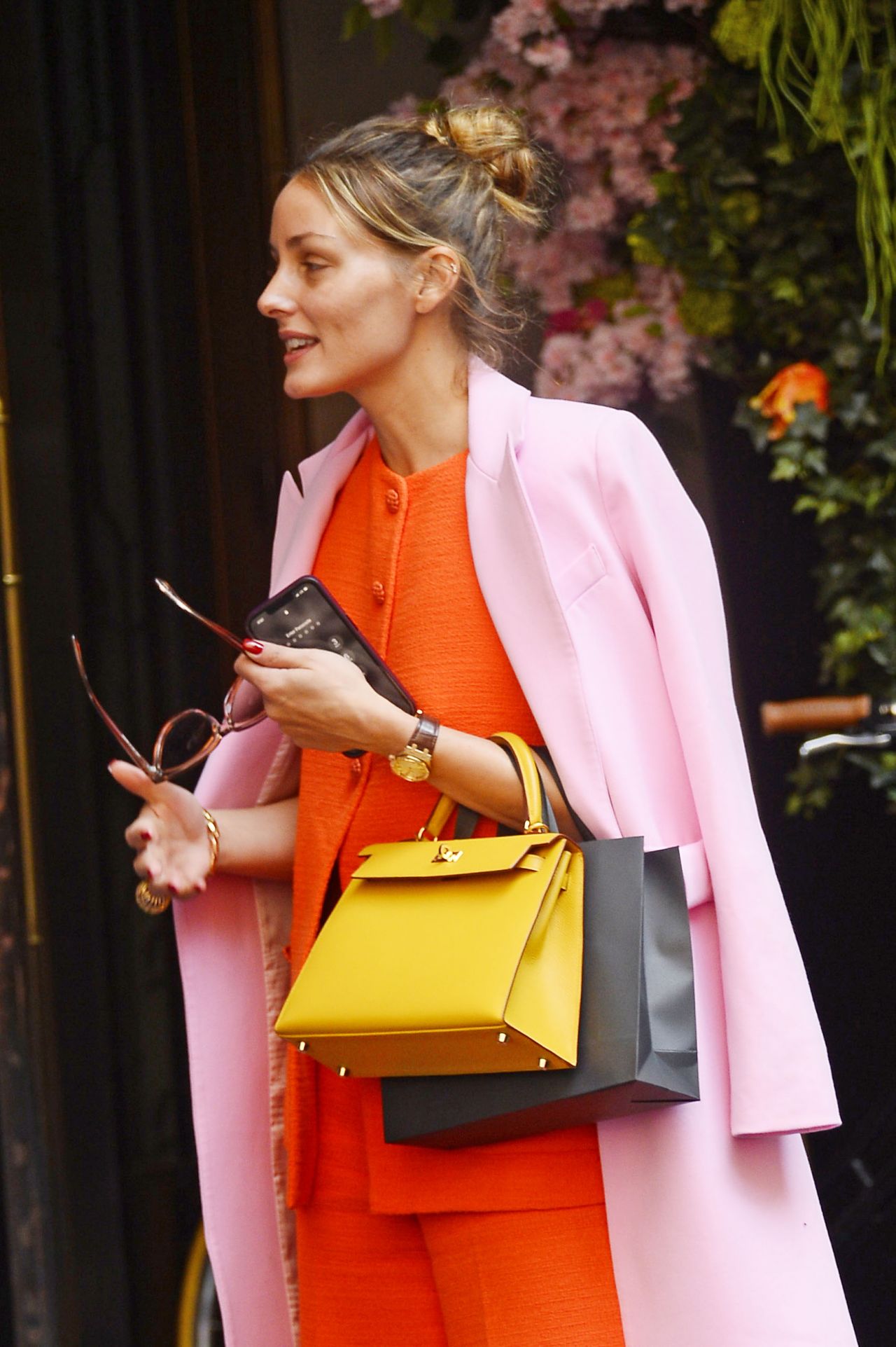 Who made Olivia Palermo's yellow handbag, red print argyle cardigan  sweater, and tassel loafer shoes? – OutfitID