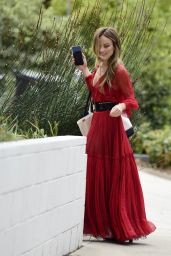 Olivia Wilde in a Semi Sheer Red Dior Tulle Dress and Black Heels in Los Angeles 09/10/2022
