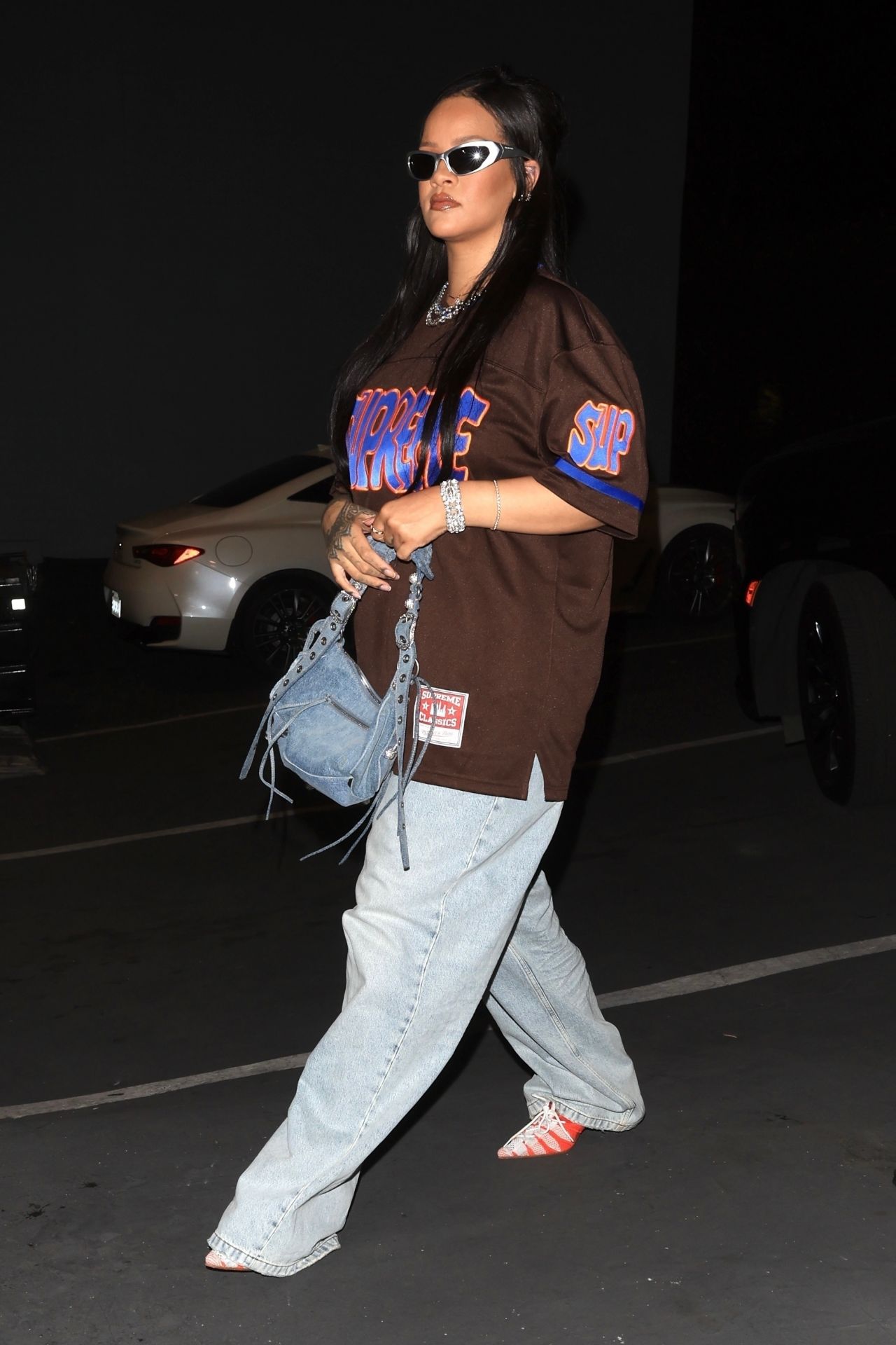 Rihanna in Varsity Jacket, Puma Sneakers and a Bright Red Louis Vuitton Bag  in Los Angeles 06/16/2023 • CelebMafia
