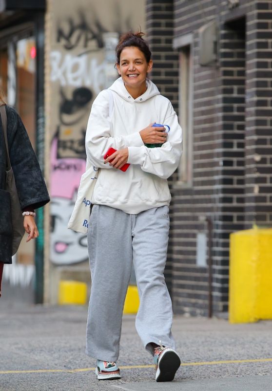Katie Holmes in Grey Sweatpants a White Sweater and a Pair of Colorful Sneakers in NYC 10/11/2022