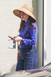 Zoey Deschanel Wears Bell Bottom Jeans and a Straw Hat at the Proper Hotel in Santa Monica 10/22/2022