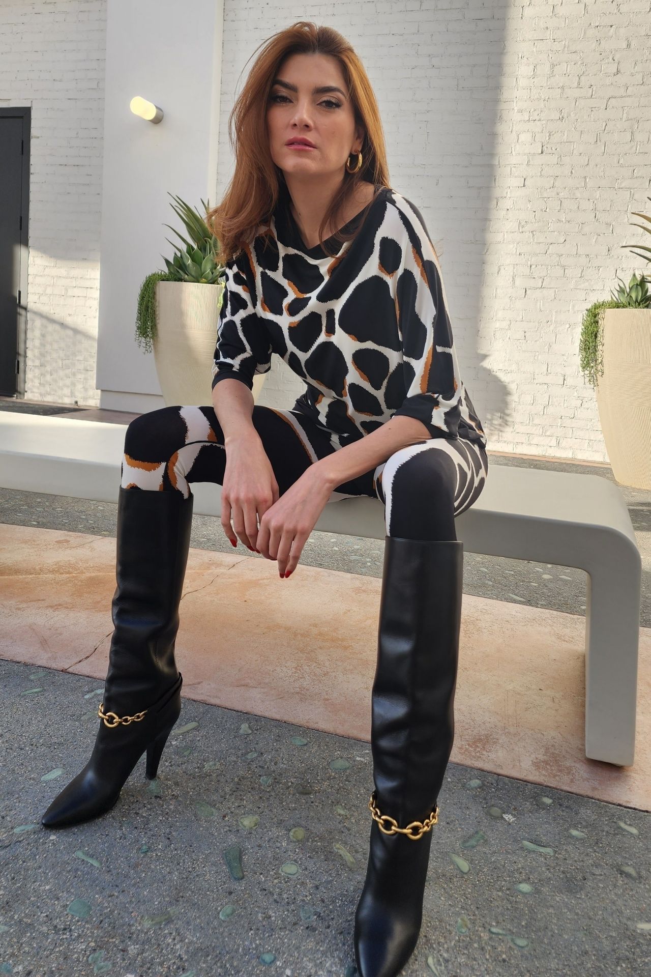 Blanca Blanco Wears an Animal Print Ensemble With Black Leather Boots ...