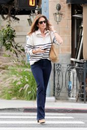 Cindy Crawford in a Stylish Striped Sweater and Dark Blue Jeans - Beverly Hills 11/30/2022