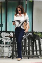 Cindy Crawford in a Stylish Striped Sweater and Dark Blue Jeans - Beverly Hills 11/30/2022