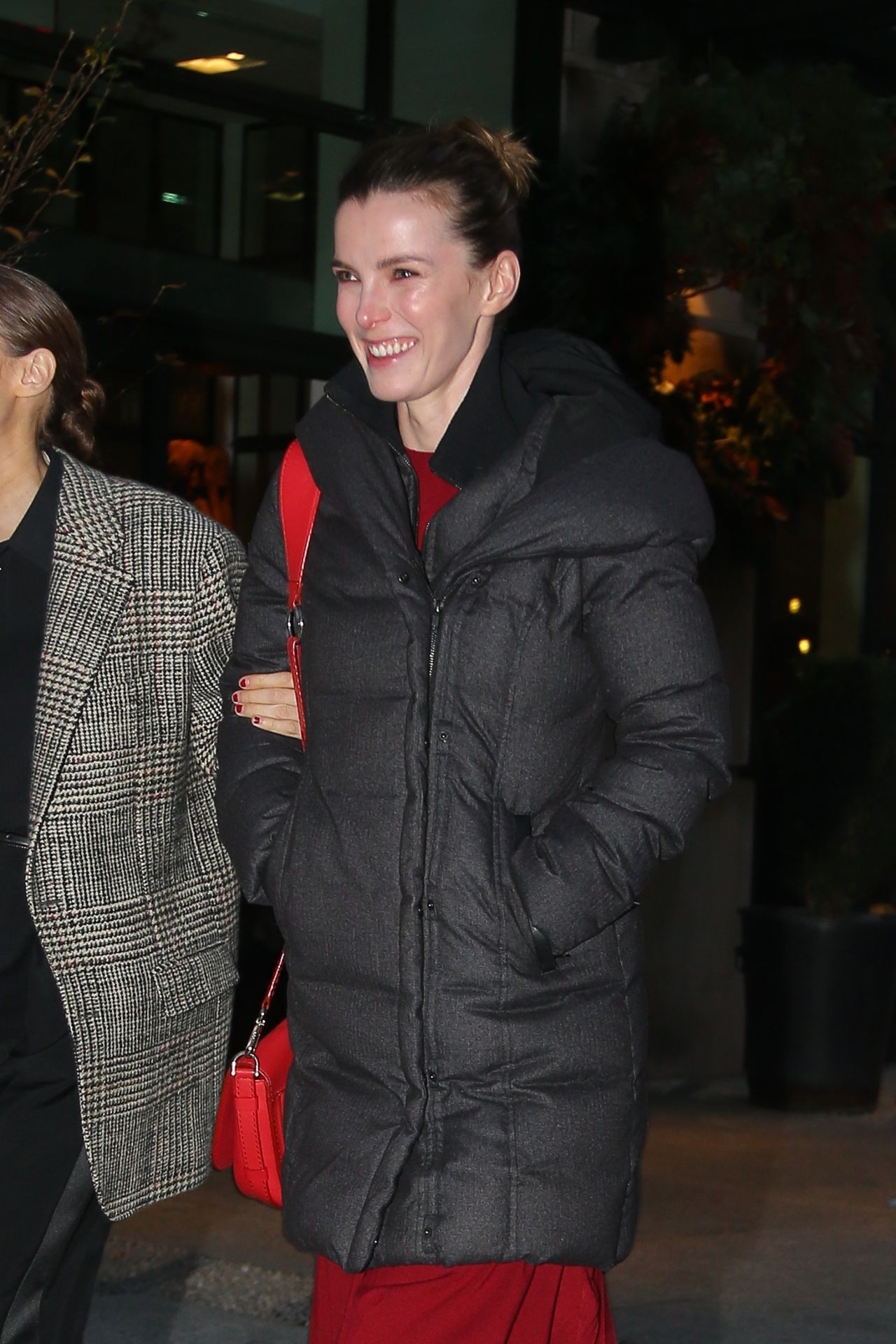 Elizabeth Gilpin in a Red Dress and Black Puffer Jacket - New York 12