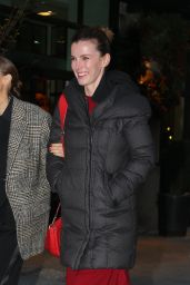 Elizabeth Gilpin in a Red Dress and Black Puffer Jacket - New York 12/12/2022