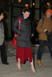 Elizabeth Gilpin in a Red Dress and Black Puffer Jacket - New York 12/12/2022