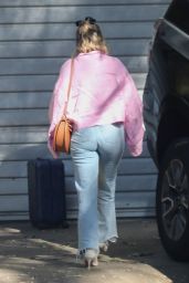 Florence Pugh in a Pink Blouse, Jeans and White Leather Booties 12/20/2022