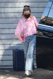 Florence Pugh in a Pink Blouse, Jeans and White Leather Booties 12/20/2022