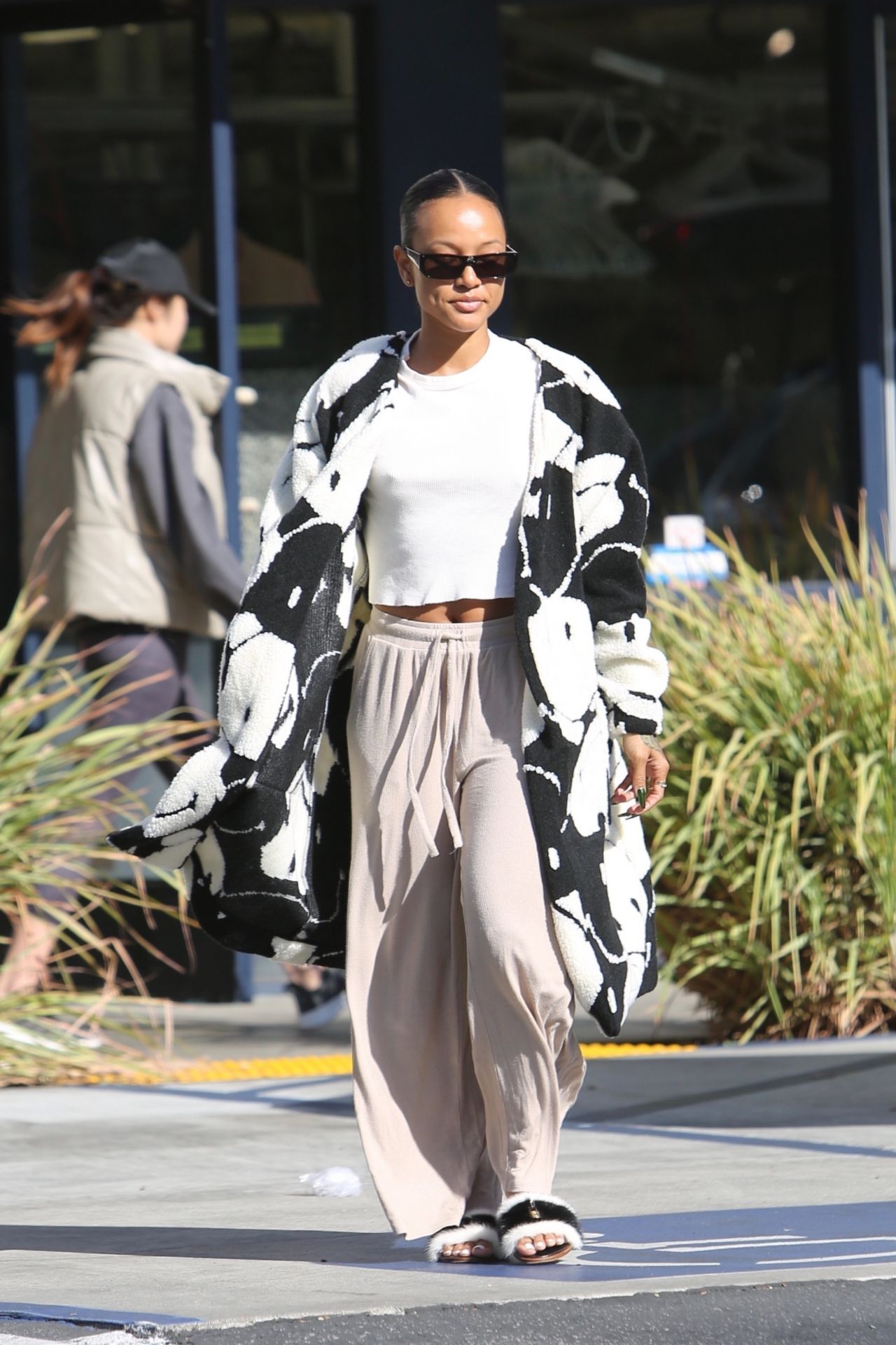 Karrueche Tran in a Pair of Cozy Sweatpants and Cropped White Top ...