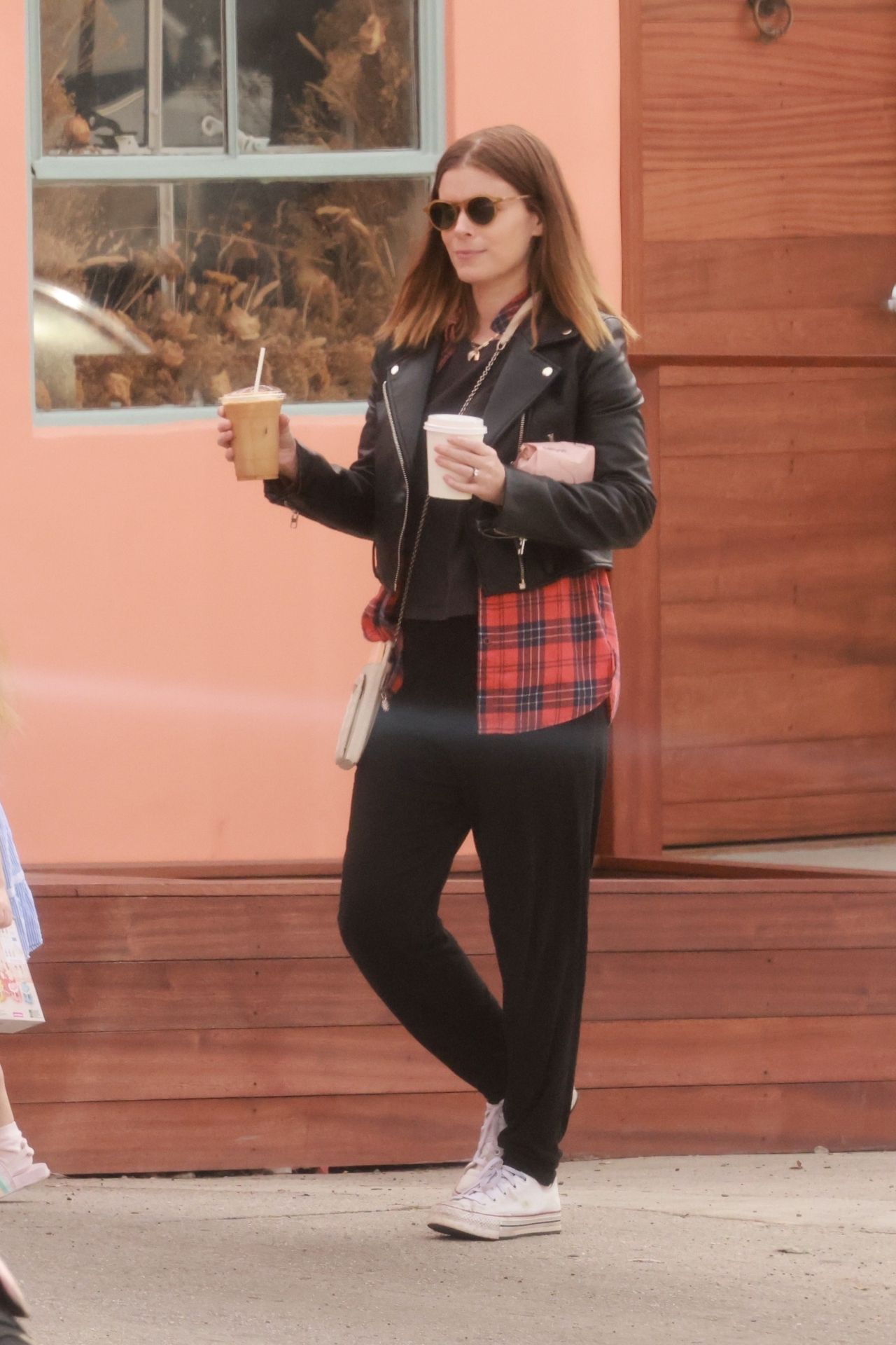 Kate Mara black leather jacket street style getting coffee