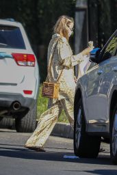 Margot Robbied in a Unique Golden Patterned Pantsuit - LA 12/21/2022