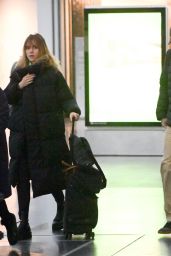 Suki Waterhouse and Robert Pattinson at JFK Airport in New York City 12/27/2022