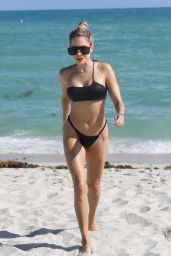 Sylvie Meis in Asymettrical Black Bikini - Beach in Miami Beach 11/30/2022