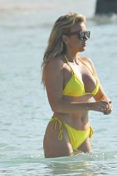 Tallia Storm in a Yellow Bikini at Sandy Lane Hotel’s Beach in Barbados 12/23/2022