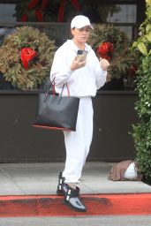 Teddi Mellencamp Wearing a White Sweatsuit and Black Ugg Boots 12/15/2022