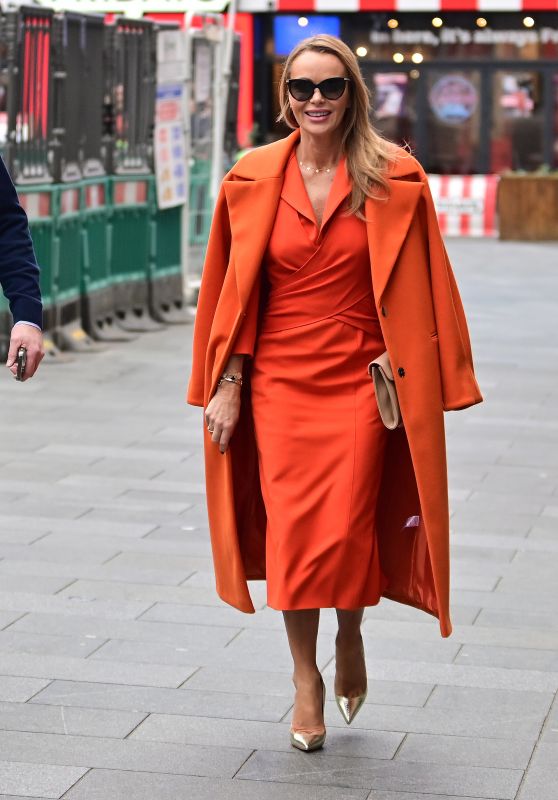 Amanda Holden in a Figure-Hugging Orange Dress and a Matching Coat - London 01/31/2023