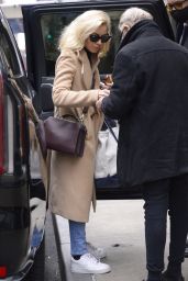 Aubrey Plaza Wears a Beige Coat, Faded Jeans and sneakers - Out in New York 01/21/2023