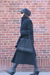 Irina Shayk Wearing Fashionable Black Getup Pairing Leather Boots with a Lengthy Black Overcoat - West Village 01/30/2023