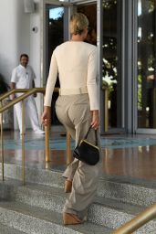 Ivanka Trump in a Creme Bodysuit Paired With Wide-leg Trousers and a Statement Belt - Miami 01/13/2023