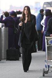 Monica Bellucci in an All-black Ensemble at JFK Airport in New York 01/28/2023