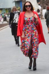 Myleene Klass in a Bright Floral Dress and Red Coat and Towering Heals - London 01/28/2023