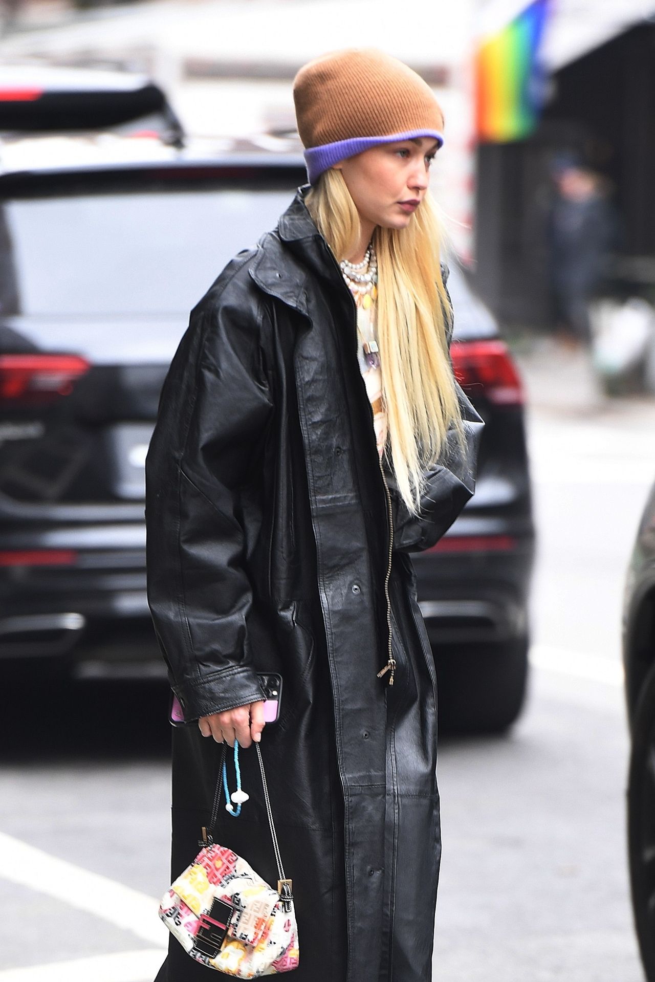 Siedres Mini Margherita Clutch Bag worn by Gigi Hadid in New York City on  October 18, 2023