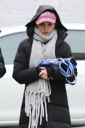 Natalia Dyer Wearing a Huge Scarf With a Long Puffer Jacket - NYC 02/25/2023