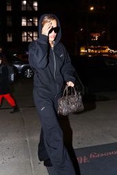 Rita Ora in an All-black Sweatsuit and Carrying Miu Miu Bag in New York 01/31/2023