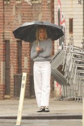 Sienna Miller in a Grey Top and White Pants - New York 02/16/2023