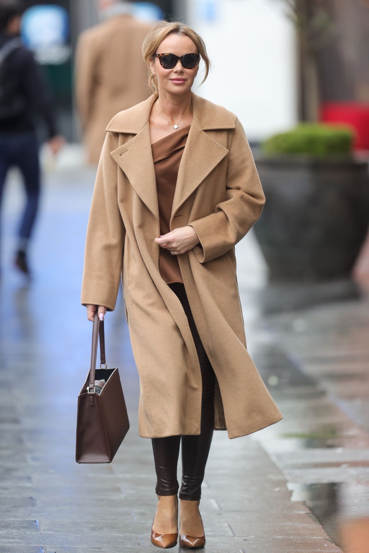 Amanda Holden in Burgundy Leather and Beige Coat in London 03/22/2023