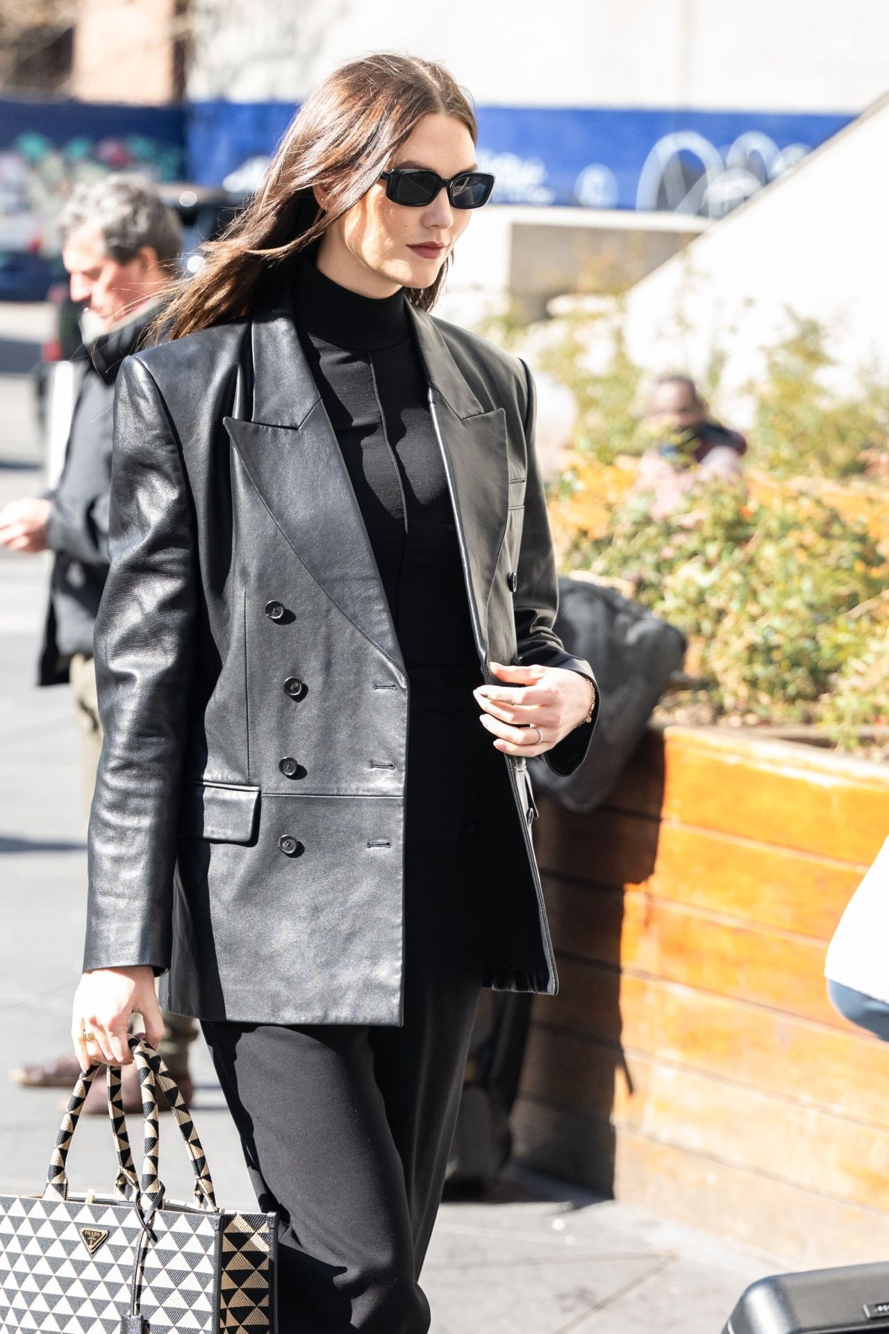 Karlie Kloss Wearing a Black Leather Jacket and Carrying a Prada Tote ...